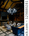 Cozy living room interior with a fireplace, TV and a modern sofa. 129880281