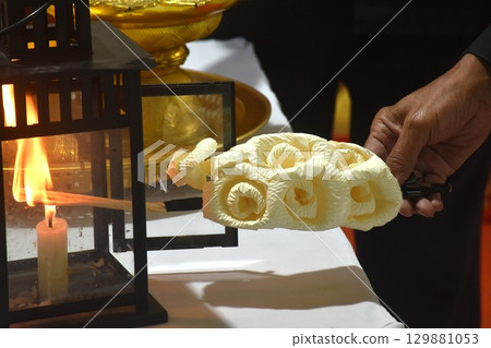 hand burning lantern sandalwood flower and robes for monks in Buddhiat funerel 129881053