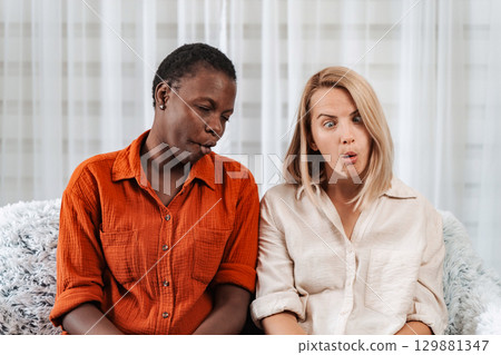 Two female friends are making funny faces and pulling silly expressions Two female friends are making funny faces and pulling silly expressions 129881347