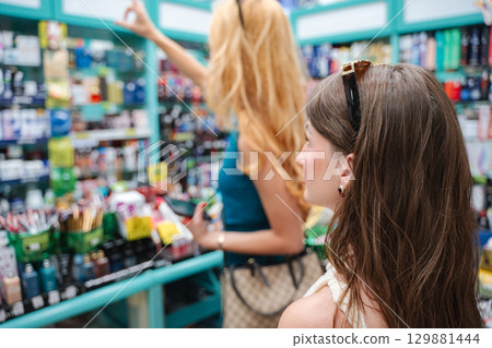 Customers looking for products in a pharmacy Customers looking for products in a pharmacy 129881444