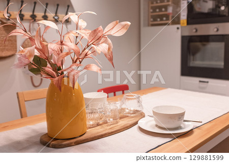 Warm-toned living room dining table decoration 129881599