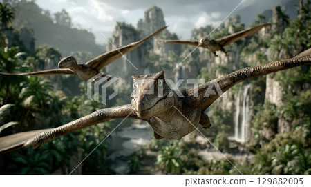Majestic pterosaurs flying over lush prehistoric landscape under dramatic skies with verdant vegetation and towering rock formations 129882005