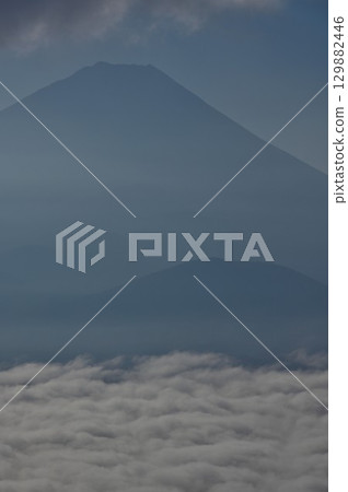 Mount Fuji shrouded in low clouds from the summit of Sanpobunzan in the Misaka Mountains 129882446
