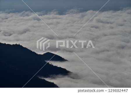 Lake Shoji shrouded in mist from the summit of Sanpobunzan in the Misaka Mountains 129882447