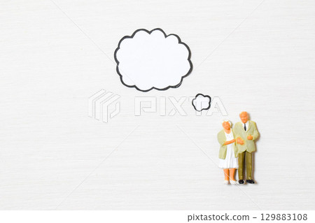 An image of an elderly couple thinking about various things 129883108