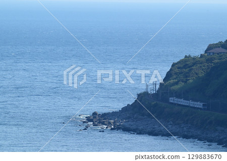 Izukyu Aloha Train running along the coastline 129883670