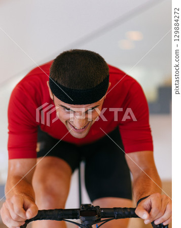 Focus Athletic Man Cycling Indoors 129884272