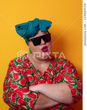 Cool plus size woman crossing arms with sunglasses Cool plus size woman crossing arms with sunglasses 129884534