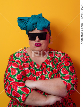 Cool plus size woman crossing arms with sunglasses Cool plus size woman crossing arms with sunglasses 129884573