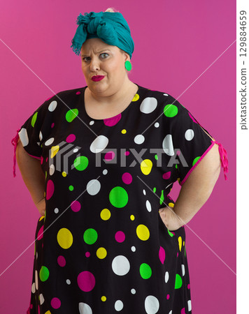 Skeptical woman posing with arms akimbo 129884659
