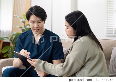 Healthcare consultation session home office professional interaction modern interior engaging dialogue for patients 129884938