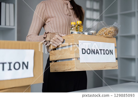 Volunteers Organizing Donation Food and Community Center for Charitable Support and Assistance 129885093