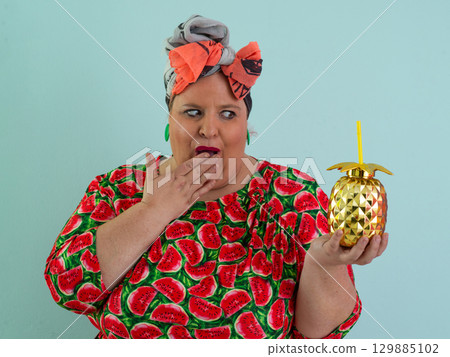 Playful Woman with Golden Pineapple Cup Wearing Watermelon Dress 129885102