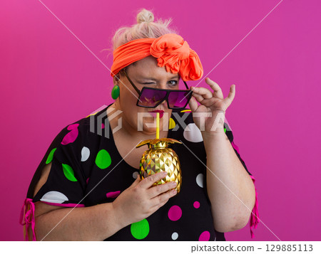 Stylish Woman with Pineapple Drink Against Pink Background Stylish Woman with Pineapple Drink Against Pink Background 129885113