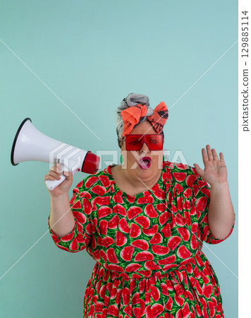 Colorful Retro Woman Shouting Through a Megaphone Colorful Retro Woman Shouting Through a Megaphone 129885114