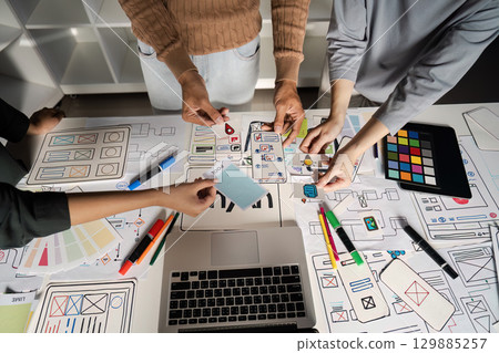 Creative UX UI Design Brainstorming Session with Diverse Team Collaborating on Innovative Digital Interface Concepts Creative UX UI Design Brainstorming Session with Diverse Team Collaborating on Innovative Digital Interface Concepts 129885257