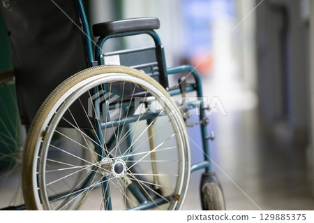 Empty Wheelchair in Hospital Hallway 129885375