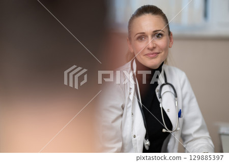 Female doctor consulting patient in office Female doctor consulting patient in office 129885397