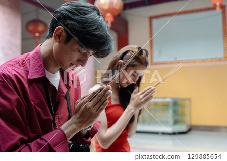 Joyful Chinese New Year Celebration with Travelers Embracing Traditions and Cultural Festivities Joyful Chinese New Year Celebration with Travelers Embracing Traditions and Cultural Festivities 129885654