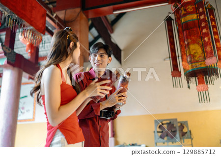 Joyful Travel During Chinese New Year Celebrations with Lanterns and Traditional Decor 129885712