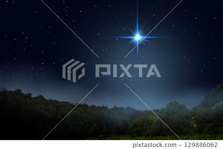 Bright star indicates the Nativity of Jesus Christ in the starry sky. 129886062