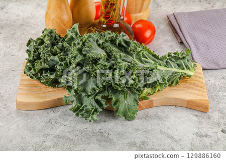 Green Kale cabbage leaves ocer board Green Kale cabbage leaves ocer board 129886160