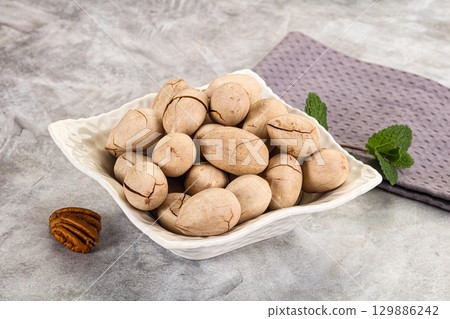 Crunchy pecan nut in the bowl Crunchy pecan nut in the bowl 129886242