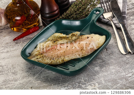 Baked tilapia fish with spices Baked tilapia fish with spices 129886306