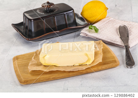 Dairy butter piece over board Dairy butter piece over board 129886402