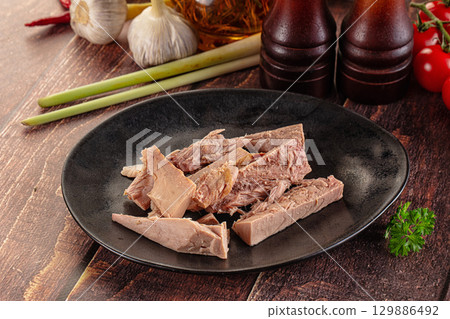 Canned tuna fish fillet pieces 129886492