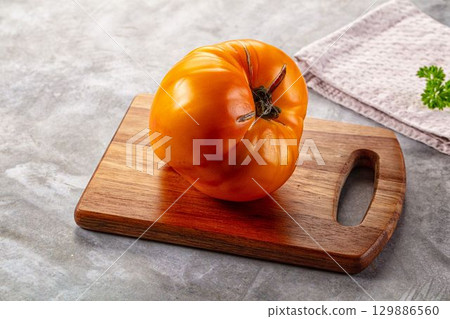 Yellow ripe juicy heart tomato Yellow ripe juicy heart tomato 129886560