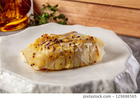 Steamed cod fish fillet with spices 129886565