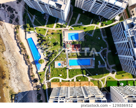 Aerial view of Punta Prima coastline. Spain 129886932