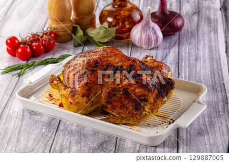 Hot tasty grilled whole chicken Hot tasty grilled whole chicken 129887005
