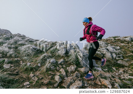 Trail Runner in Misty Mountain Landscape 129887024