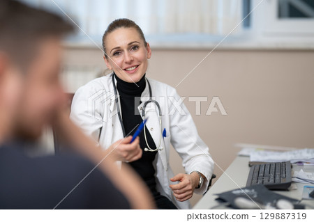 Female doctor consulting patient in office Female doctor consulting patient in office 129887319