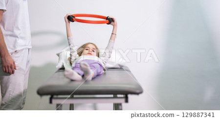 Child Doing Physical Therapy with Ring Child Doing Physical Therapy with Ring 129887341