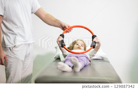 Child Doing Physical Therapy with Ring Child Doing Physical Therapy with Ring 129887342