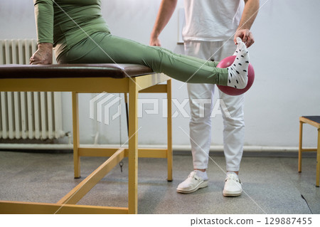 Leg Therapy Exercise with Ball 129887455