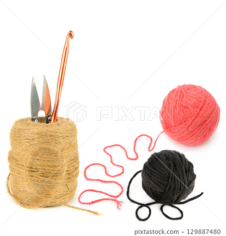 Craft Supplies for Knitting and Crocheting, Yarn, Twine, and Tools on a White Background. Craft Supplies for Knitting and Crocheting, Yarn, Twine, and Tools on a White Background. 129887480