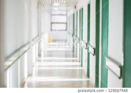 Empty Hospital Hallway with Natural Light 129887486