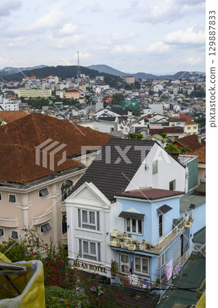Aerial view of the asian city with mountains on the horizon 129887833