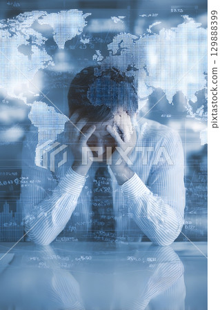 frustrated investor checking market analysis with global taxes overlay frustrated investor checking market analysis with global taxes overlay 129888399