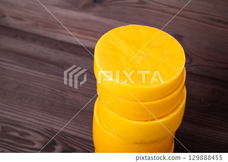 Beeswax in discs from used frames. Reusing wax concept, making new honeycomb foundation wax frames Beeswax in discs from used frames. Reusing wax concept, making new honeycomb foundation wax frames 129888455