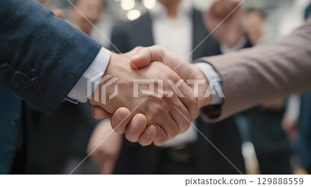 Client and agency partners shaking hands after successful meeting, partnership theme, Client and agency partners shaking hands after successful meeting, partnership theme, 129888559