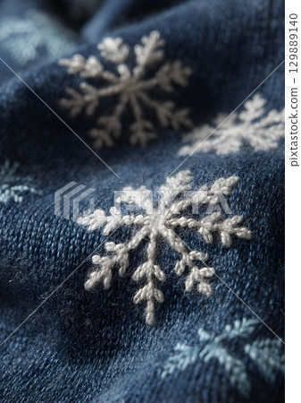 closeup of snowflakes on wool scarf closeup of snowflakes on wool scarf 129889140