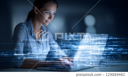 woman typing on laptop with futuristic data interface overlay modern digital business concept 129889462