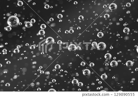 Dark oil with bubbles. Bubbles in liquid. Black and white. Oil concept. Oil business concept  129890555