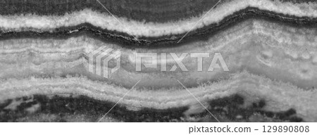 Agate surface background. Black and white transparent crystal background. Macro 129890808