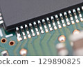 Microchip close-up on electronic board. Macro 129890825